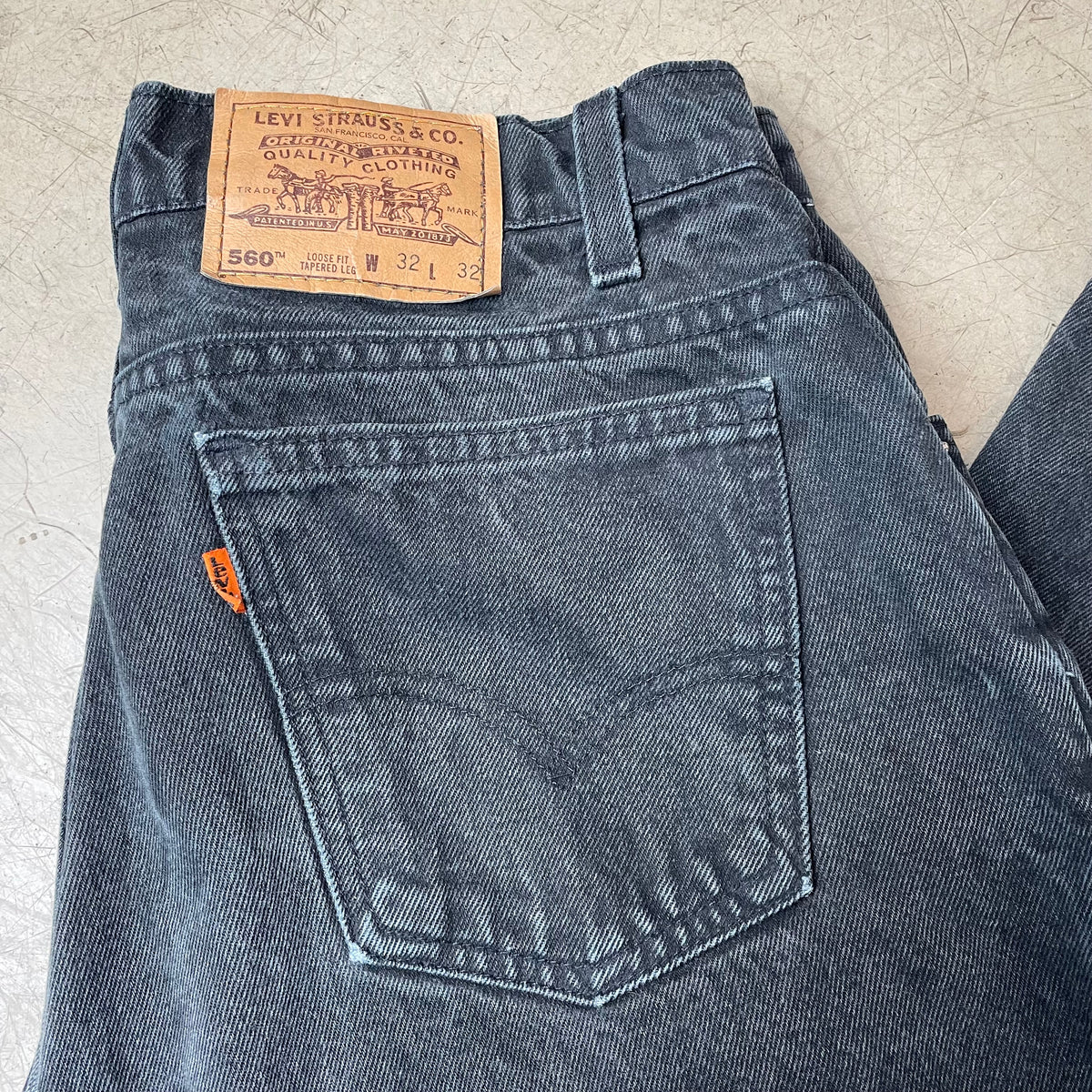 (M) Vintage Levi’s 560 Orange Label Jeanshose faded black W32/L32