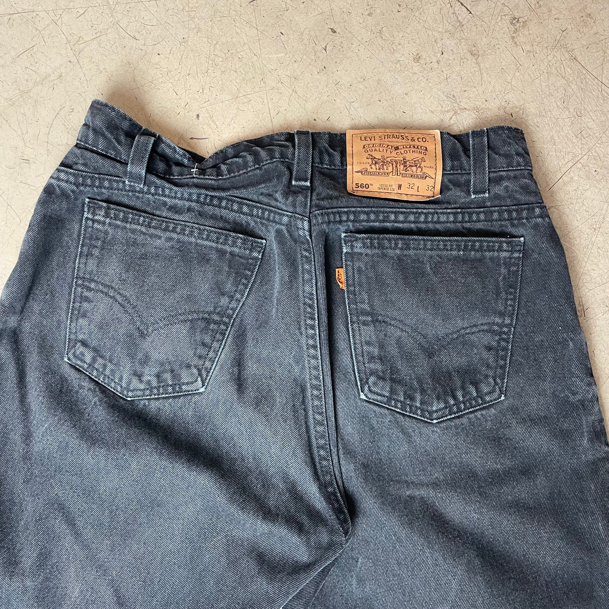 (M) Vintage Levi’s 560 Orange Label Jeanshose faded black W32/L32